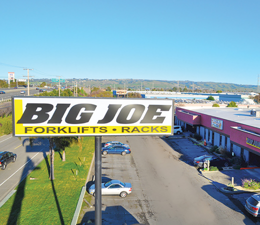 The Big Joe sign in the parking lot of a forklift facility