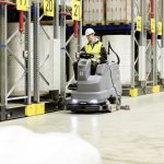 Thumbnail of http://A%20Worker%20Operating%20a%20Karcher%20B150R%20Ride%20on%20Scrubber%20Inside%20a%20Warehouse%20Aisle