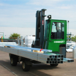 Thumbnail of http://A%20Combilift%20C-Series%20Multidirectional%20Forklift%20Carrying%20a%20Load%20of%20Metal%20Bars%20Outside%20in%20a%20Lot