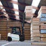 Thumbnail of http://A%20Unicarriers%20MXL%20forklift%20loading%20lumber%20inside%20of%20a%20warehouse