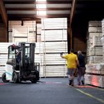 Thumbnail of http://A%20Unicarriers%20MXL%20forklift%20inside%20of%20a%20warehouse%20with%202%20workers%20standing%20in%20front%20of%20it