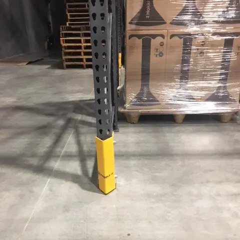 A Steel Bolt on Protector on a Pallet Rack Upright Inside a Warehouse