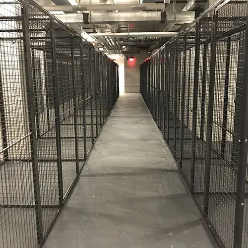 A row of empty warehouse cages in a warehouse