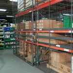 Thumbnail of http://Rackback%20pallet%20rack%20safety%20panels%20installed%20on%20a%20row%20of%20pallet%20racking%20inside%20of%20a%20warehouse