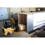 Thumbnail of http://A%20Bendi%20B30AC%20forklift%20loading%20a%20pallet%20inside%20of%20a%20truck%20trailer