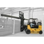 Thumbnail of http://a%20drexel%20swingmast%20forklift%20unloading%20a%20steel%20bar%20inside%20of%20a%20warehouse