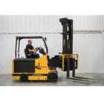 Thumbnail of http://A%20worker%20operating%20a%20sl60%20drexel%20swingmast%20forklift%20inside%20of%20a%20warehouse