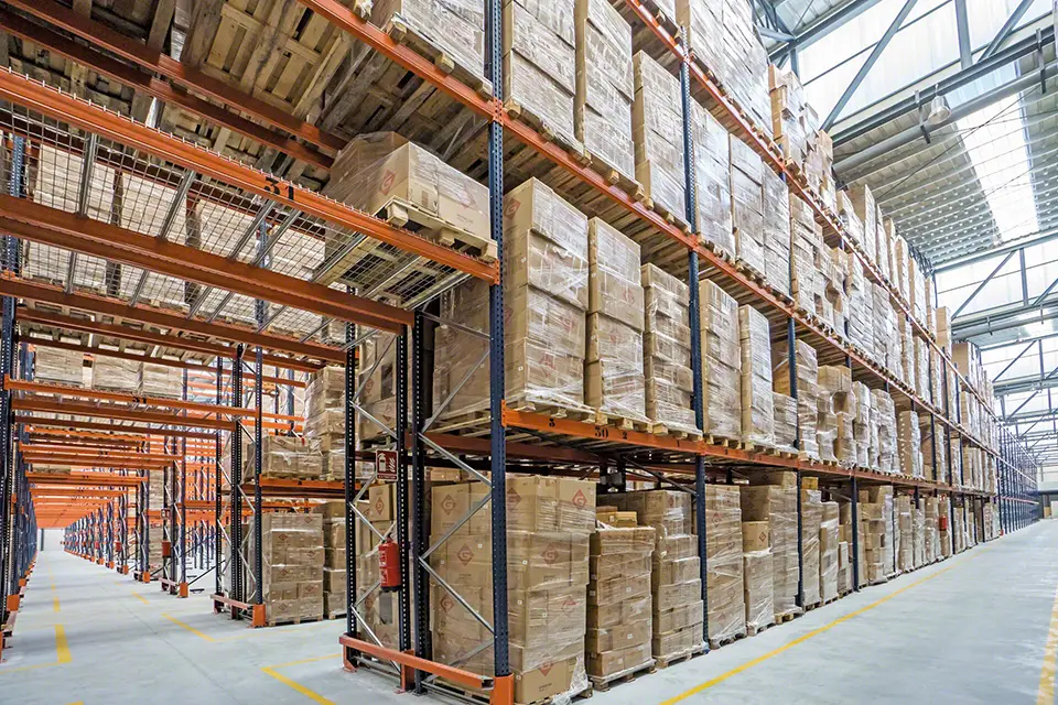 Pallet racking inside of a warehouse filled with boxes